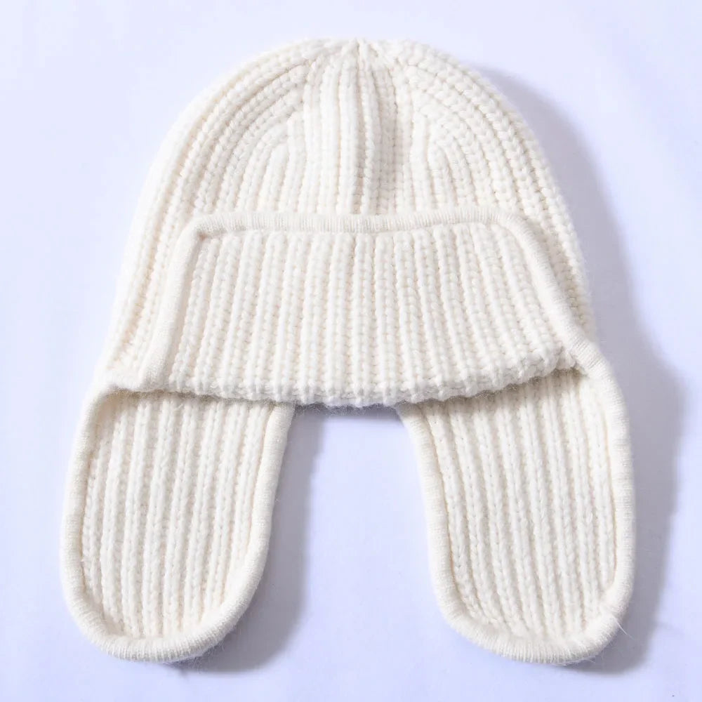 Close-up of the knit pattern on a women's cashmere blend beanie, emphasizing quality.