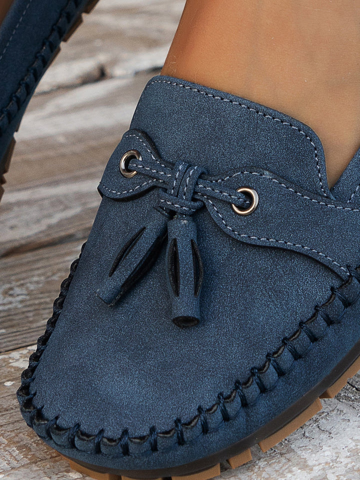 Chic women's slip-on loafers, soft construction & cushioned support for prolonged wear.