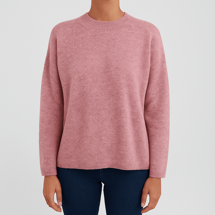 Women's soft round neck pullover sweater in light pink, perfect for casual winter fashion.