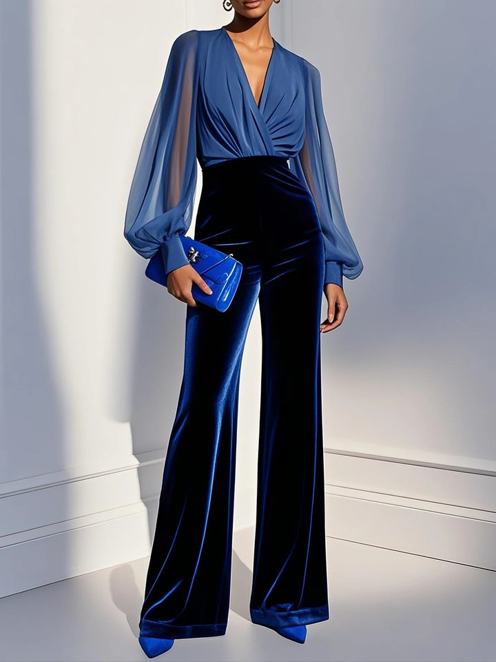 Women's sophisticated blue mesh V-neck jumpsuit, perfect for elegant evening wear & special occasions. Long sleeve, wide leg.