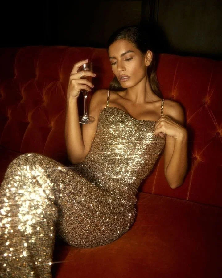 Elegant gold glitter strapless jumpsuit with chic waist belt for women's evening parties.