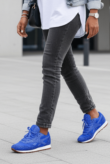 Back view of women's shimmering glitter sneakers, showcasing stylish detailing & comfortable design.