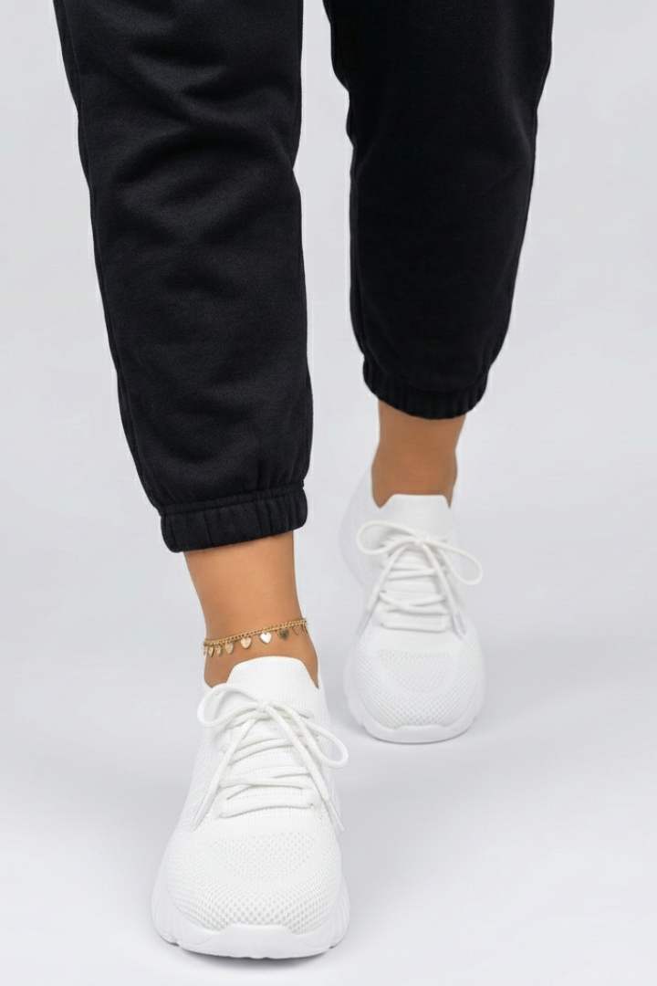 Lace-up women's sports sneakers featuring a responsive textured sole for enhanced grip & comfort.