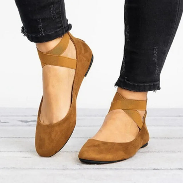 Pair of women's spring cross-strap ballet flats, ideal for warm weather, offering style and comfort.