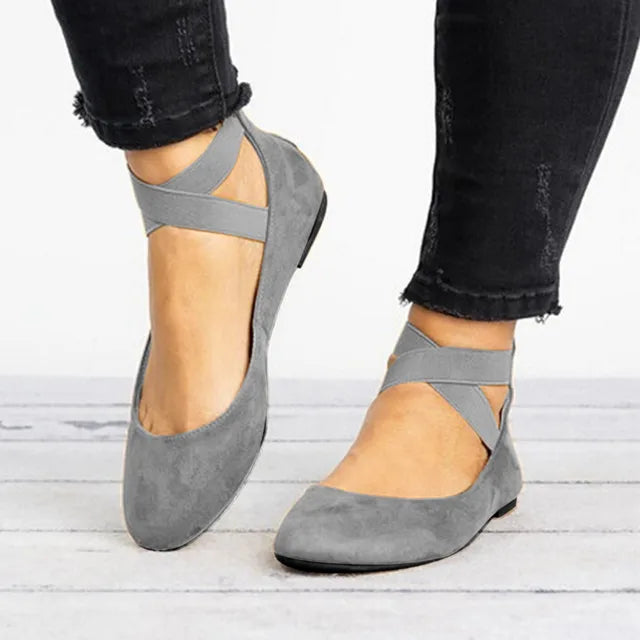 Stylish women's ballet flats with unique cross-strap detail, a versatile spring shoe for any occasion.