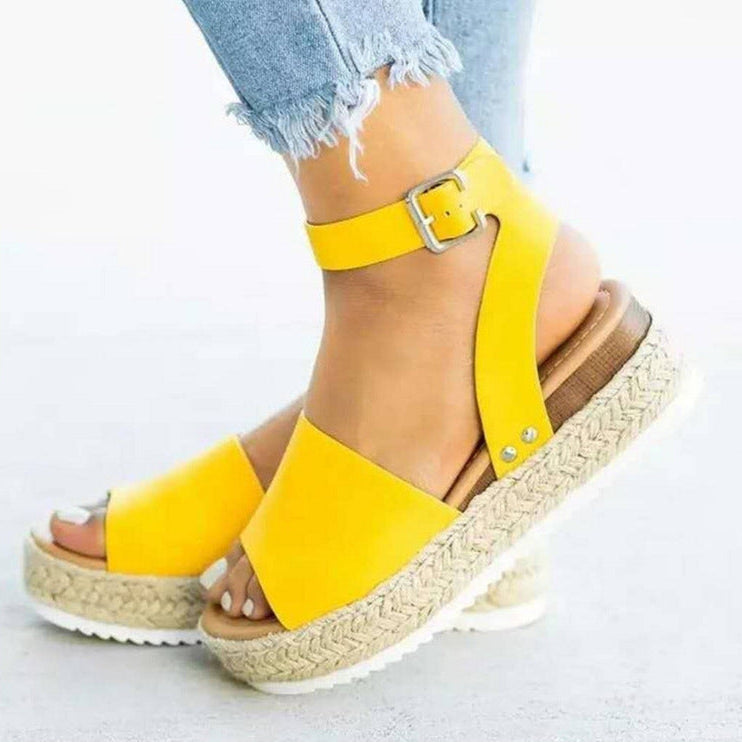 Casual women's spring footwear: brown flatform sandals with a chic ankle buckle strap