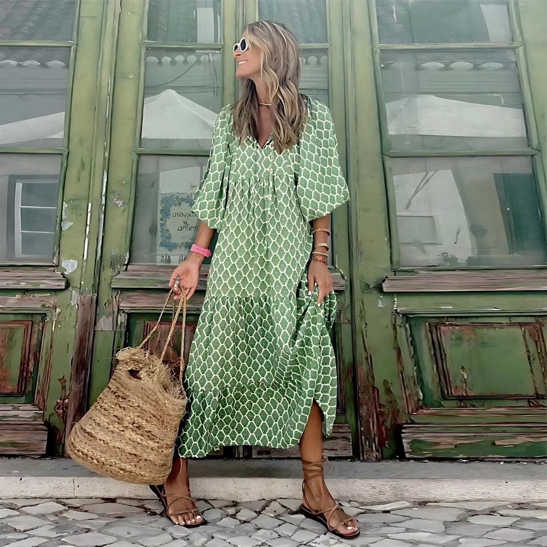 Stylish women's spring patterned maxi dress with long sleeves, flowing silhouette, & flattering V-neck.