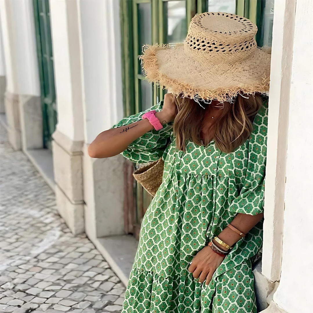 Vibrant women's spring patterned maxi dress with long sleeves, V-neck, offering elegant & casual style.