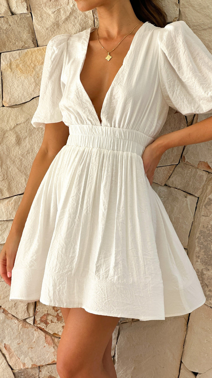 Elegant short mini dress for women featuring fashionable puff sleeves, ideal as a versatile day dress.