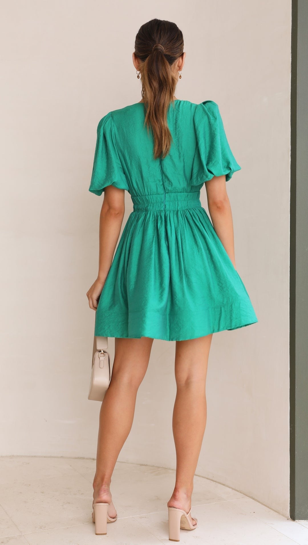 Versatile women's mini dress with puff sleeves, suitable for various spring occasions and casual wear.