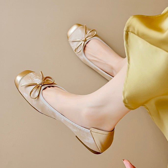 Close-up of women's square toe ballet flats highlighting the elegant decorative bow.