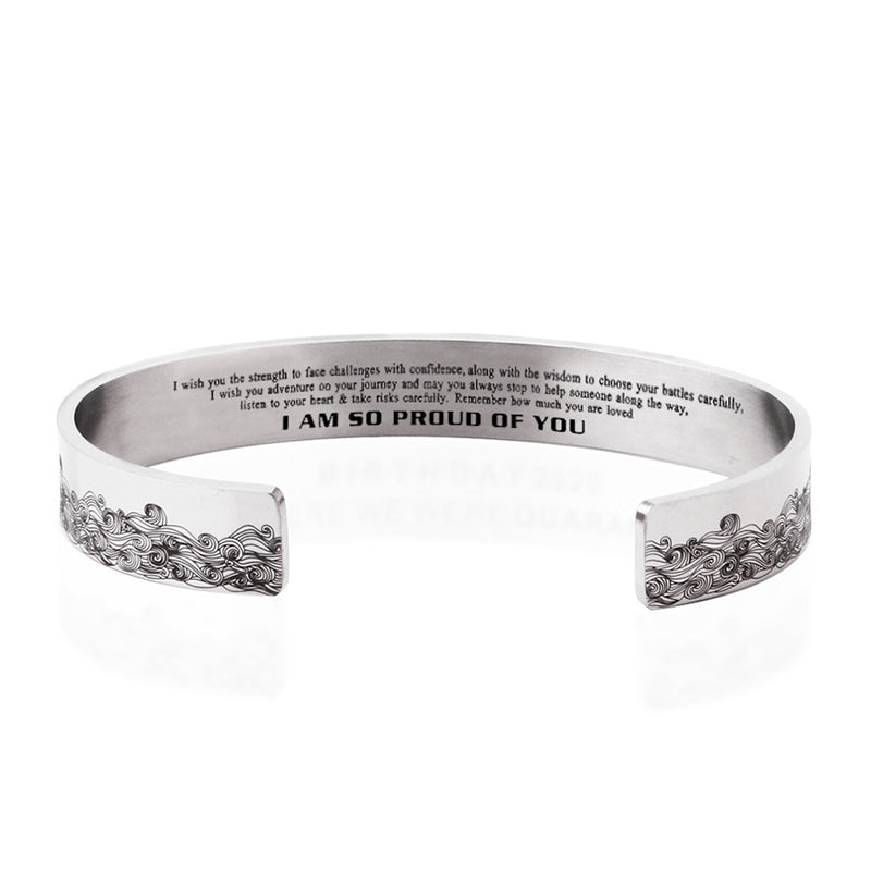 Adjustable stainless steel bracelet featuring a delicate sea wave motif
