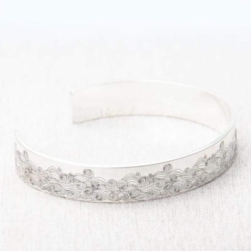 Friendship bracelet: stainless steel open wave design, adjustable band