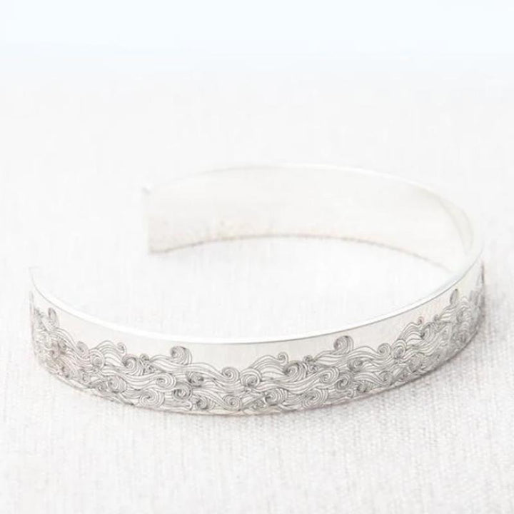 Friendship bracelet: stainless steel open wave design, adjustable band