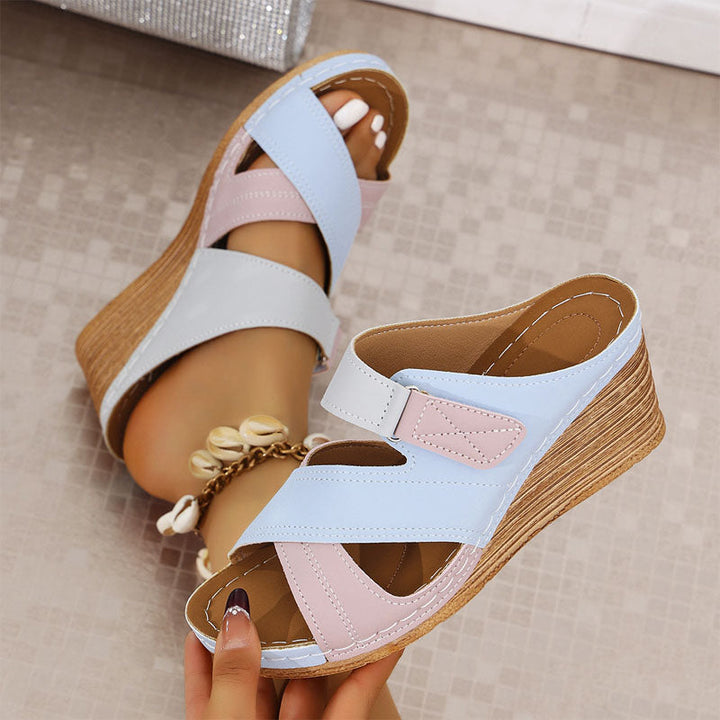 Casual women's strappy wedge sandals. Open-toe platform design offers cushioned comfort, great for versatile summer style.