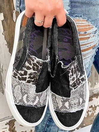 Pair of women's stretch canvas slip-on shoes with trendy leopard print design