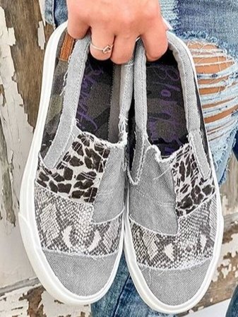 Side view of women's comfortable leopard print slip-on sneakers for easy everyday style