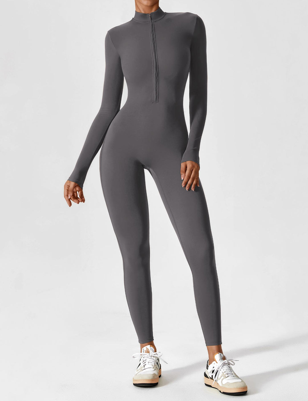 Detailed view of the neckline and zipper of a women's stretchy jumpsuit, a casual spring essential