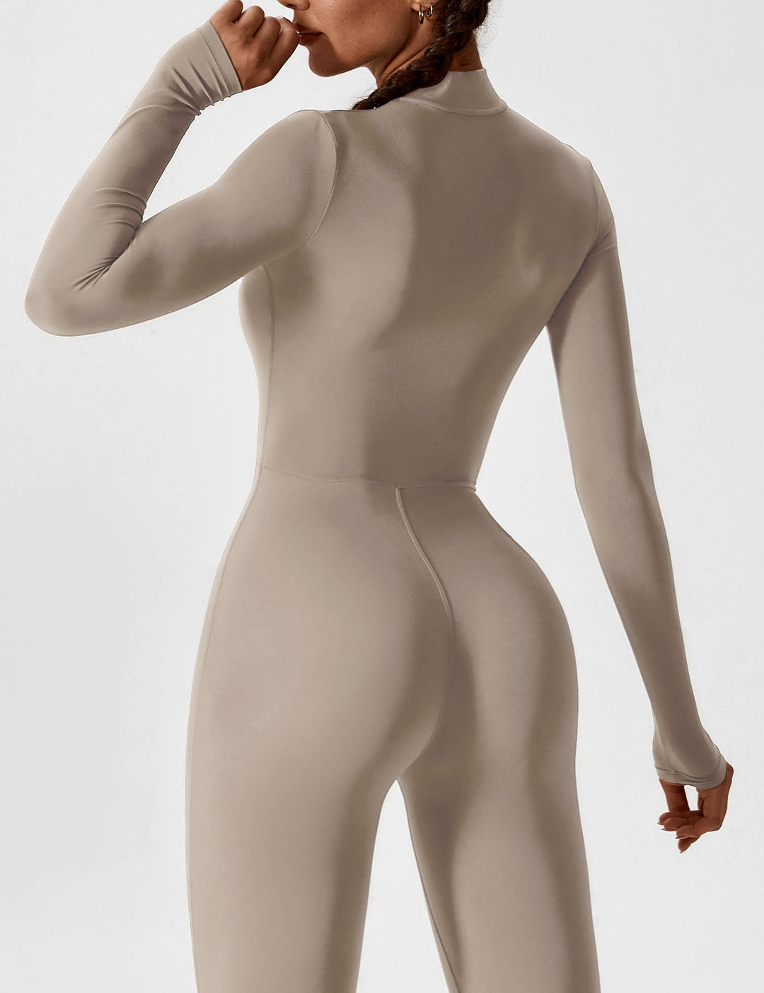 Close-up on the stylish collar and zipper of a women's stretchy jumpsuit, defining spring fashion