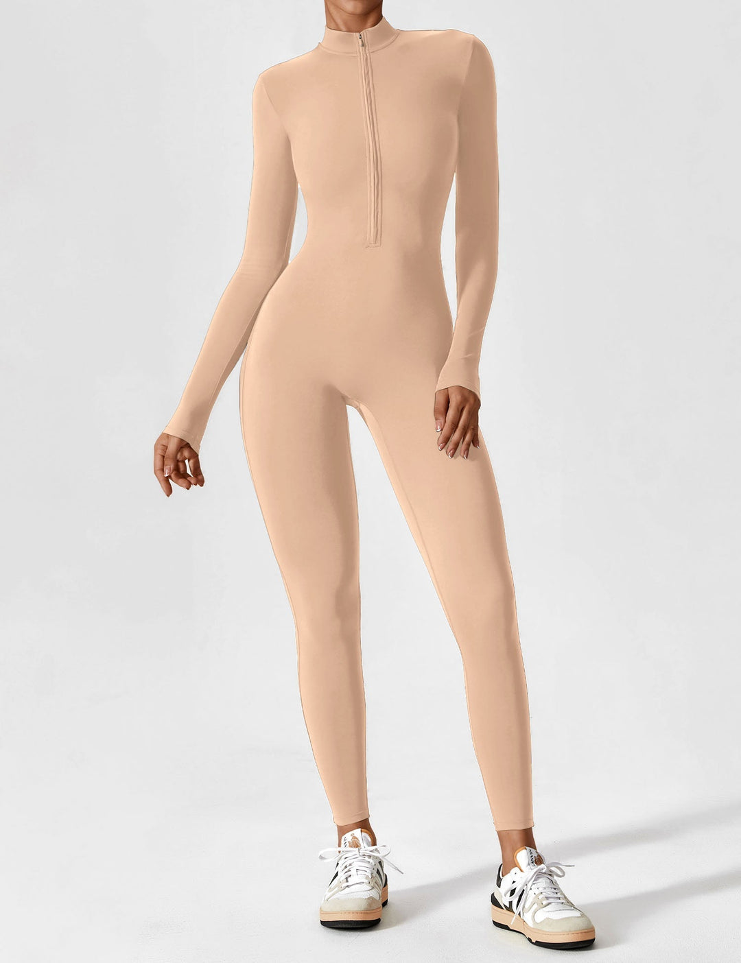 Woman enjoying a picnic in a comfortable stretchy zip-up jumpsuit, perfect for spring outdoors