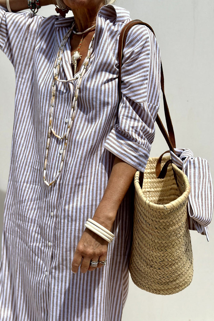 Effortless casual women's striped midi dress, collared button-down design for comfortable summer style.