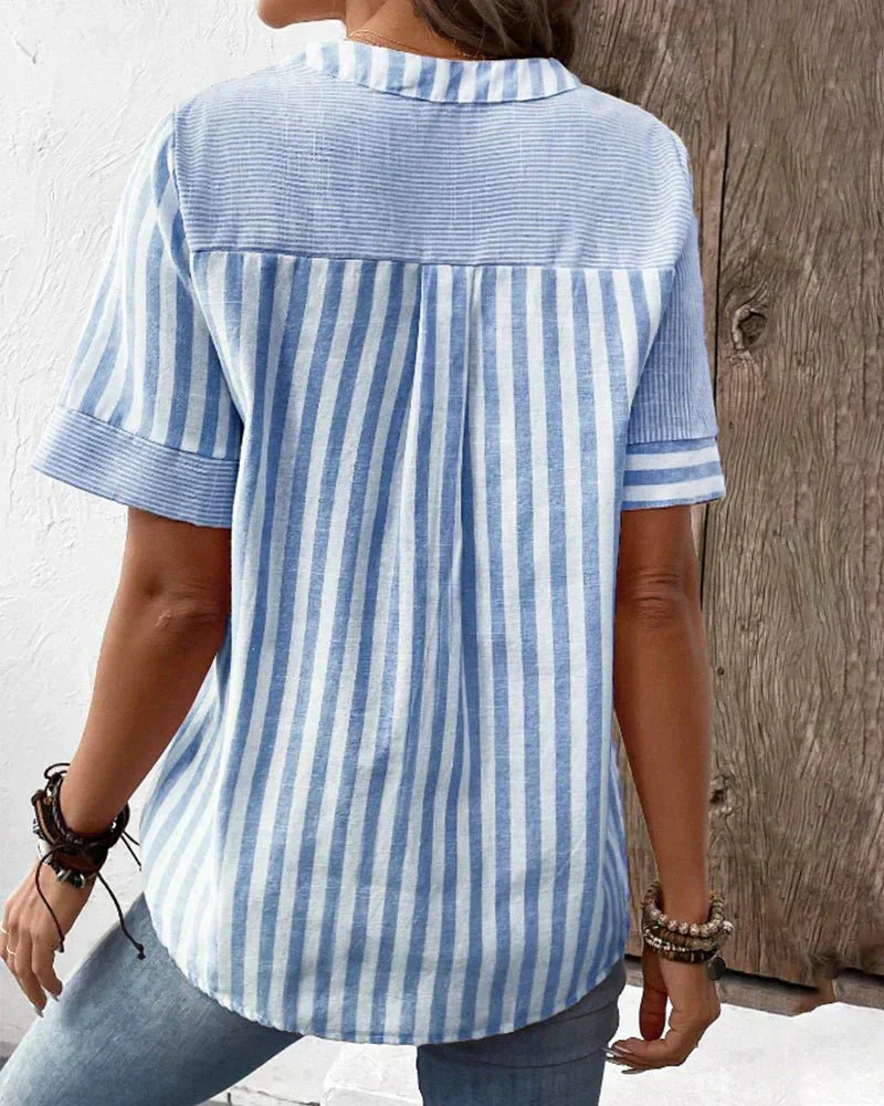 Fashionable women's striped colorblock top with a half-button design, great for casual or smart spring wear.