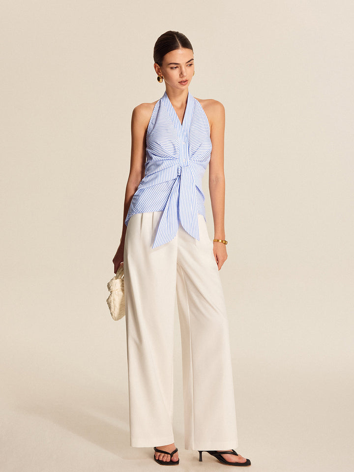 Elegant women's striped halter blouse with a stylish tie-front. Ideal for office style or a chic summer look.