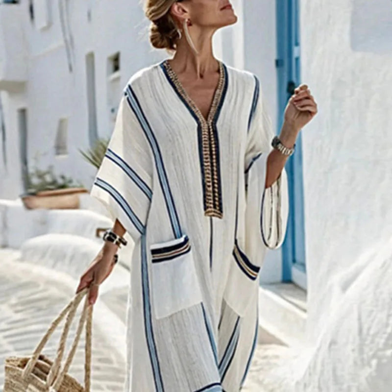 Flowy striped kaftan dress for women, ideal as comfortable summer beachwear or casual vacation resort wear.