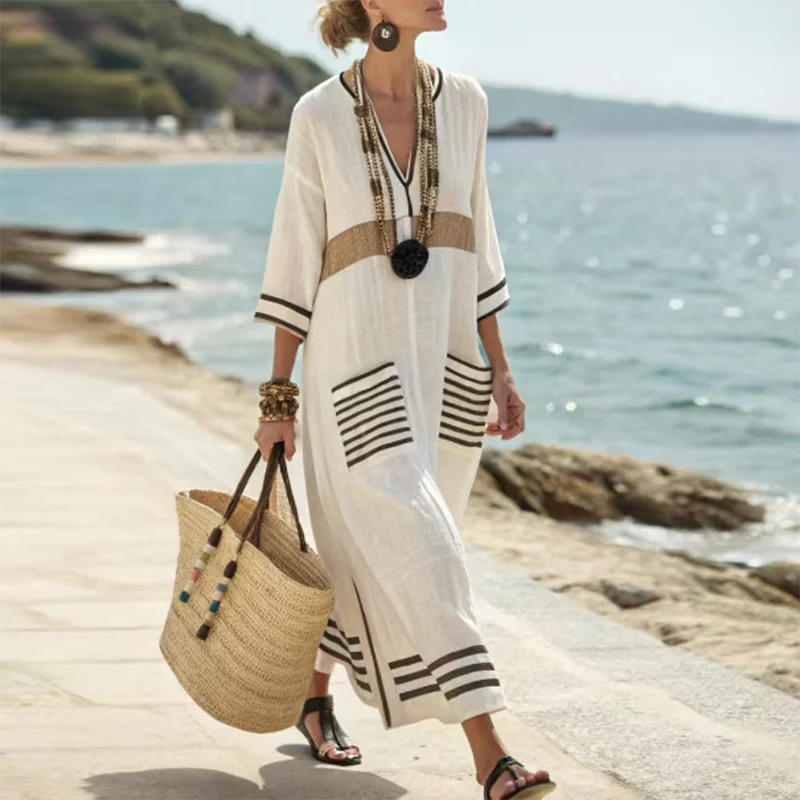 Effortless women's striped kaftan dress, a flowy maxi perfect for summer beach days, vacation, and resort wear.