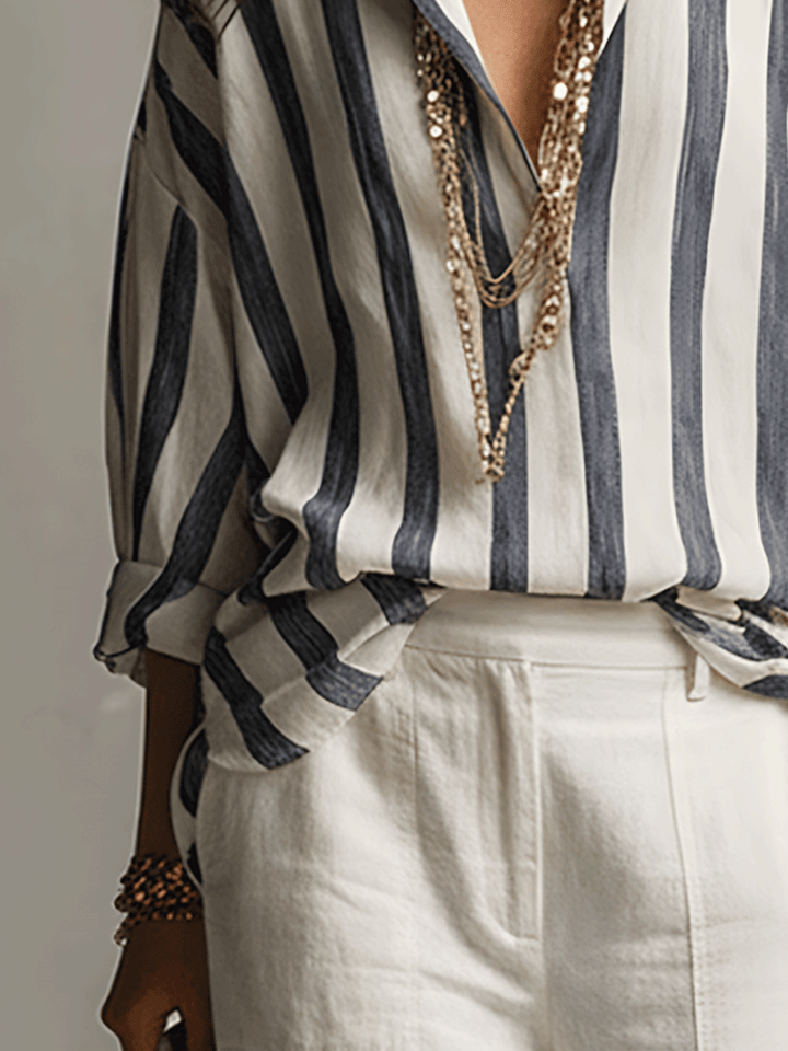 Comfortable women's striped button-front blouse. Long sleeves and relaxed fit for versatile, smart casual wear.