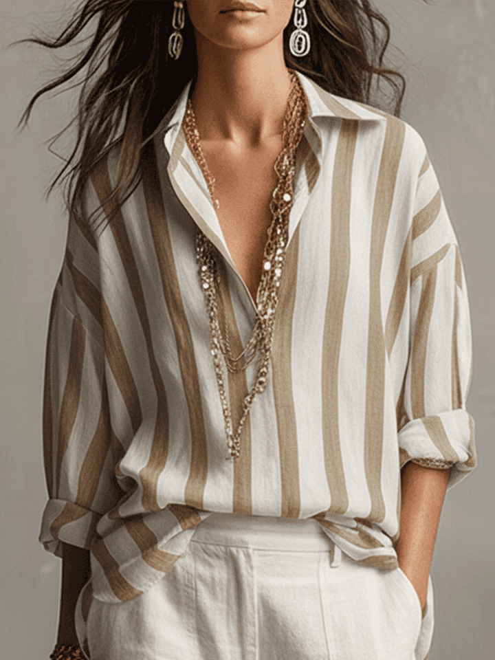 Versatile women's striped button-front blouse. Long sleeves, perfect for smart casual or relaxed fashion.