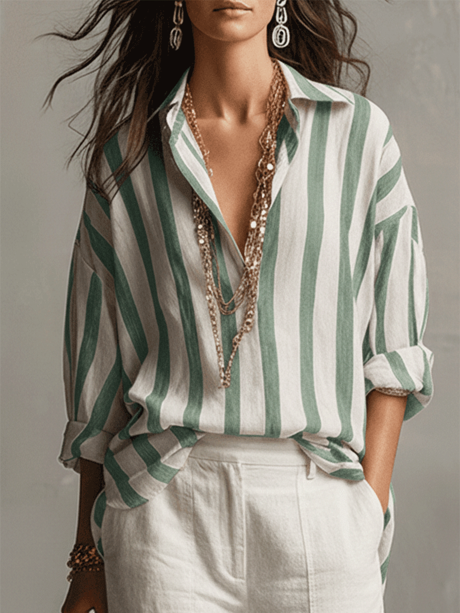 Relaxed fit women's striped long sleeve blouse. Features a classic button front, ideal for comfortable daily fashion.