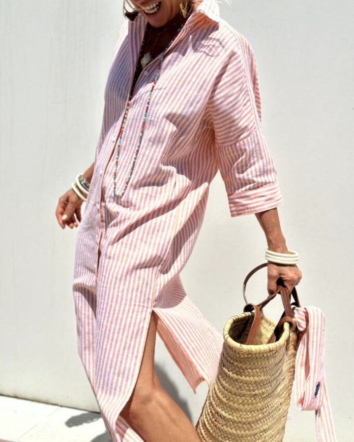 Elegant women's blue striped midi shirt dress. Features button closure & practical pockets. Perfect for day or casual wear.