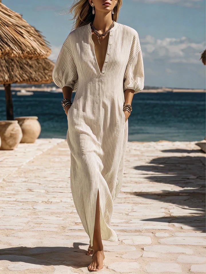 Women's striped V-neck maxi dress with elegant puff sleeves and full button-down front.