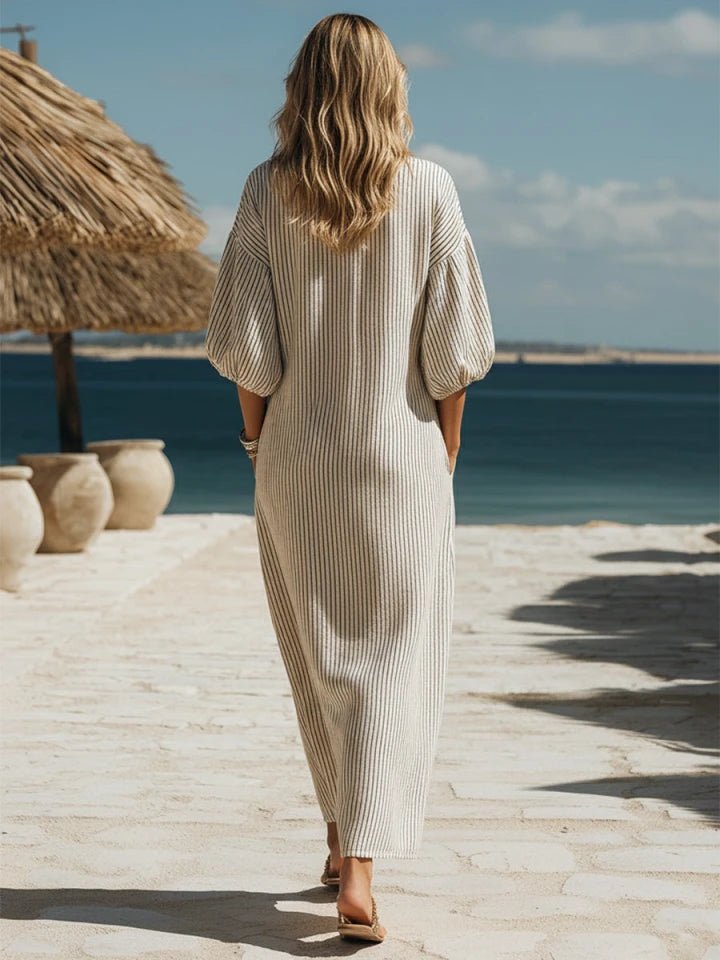 Women's summer striped V-neck dress with puff sleeves and a comfortable flowy fit.