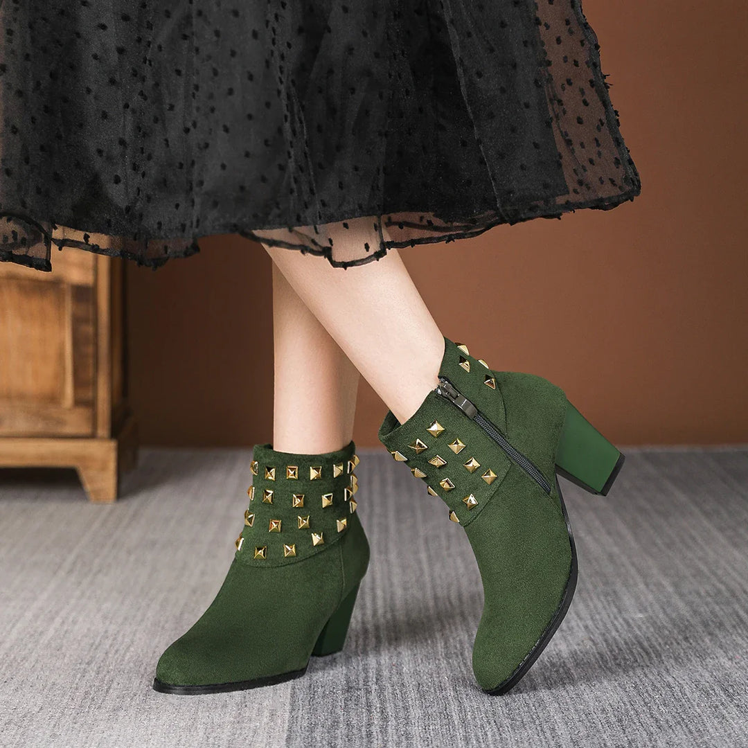 Women's black ankle boots with studded detail and sturdy block heel. Comfort and fashion combined.