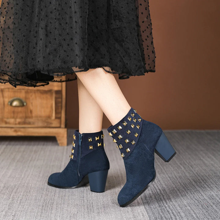 Elegant women's studded ankle boots perfect for various occasions. Block heel and side zip.