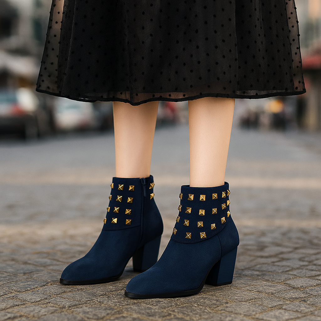 Close up of studded collar on women's ankle boots. Black leather, fashionable design, comfort.