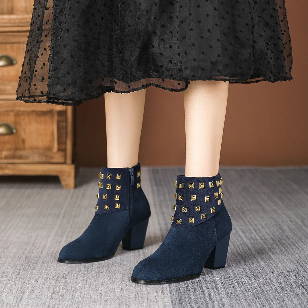 Stylish women's studded ankle boots, perfect for adding an edgy touch to any outfit.