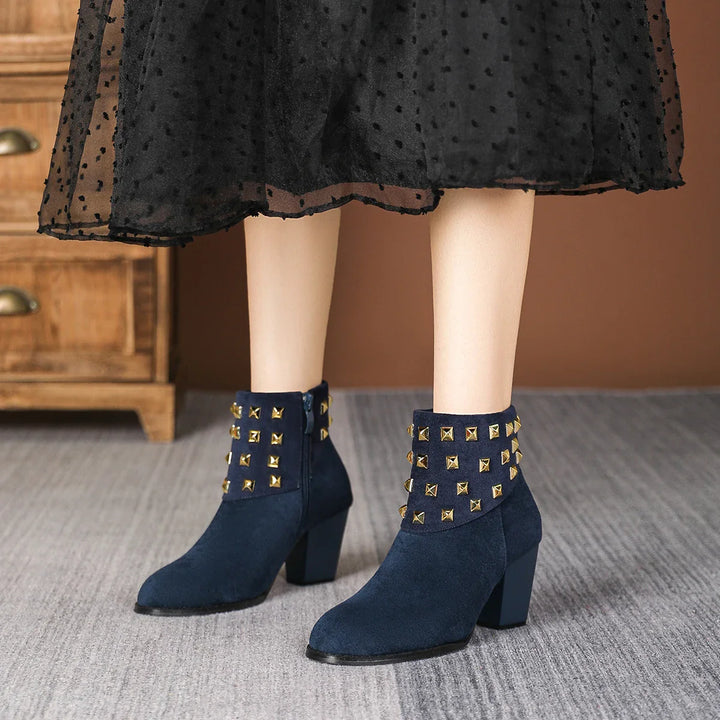 Stylish women's studded ankle boots, perfect for adding an edgy touch to any outfit.