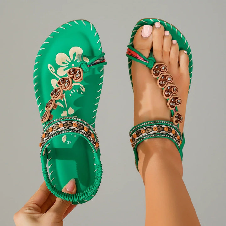 Women's stylish flat thong sandals with a bohemian floral design, ideal for beach vacations.