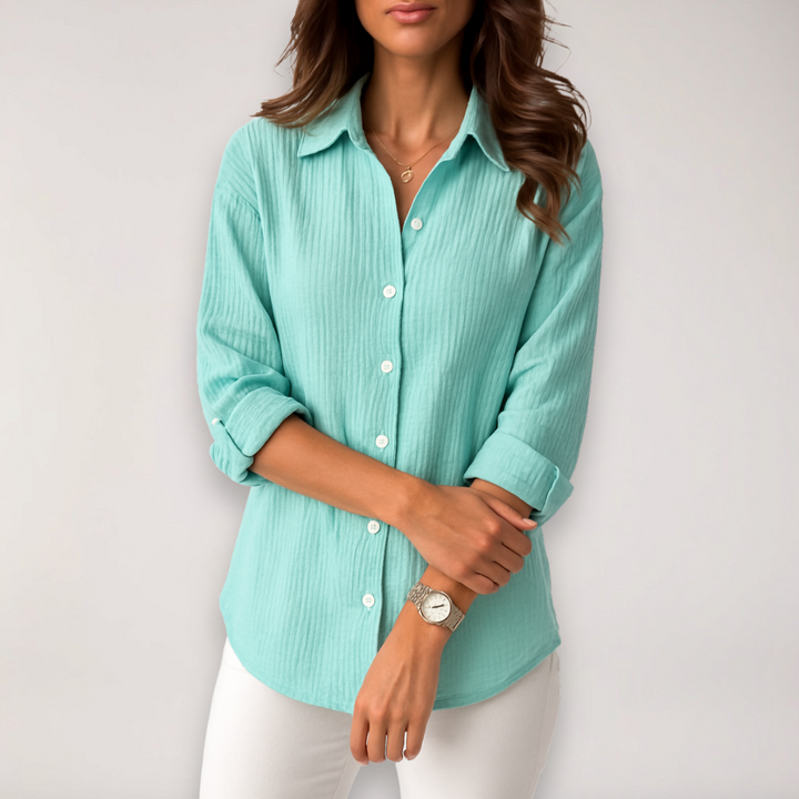 Stylish women's long sleeve button blouse, versatile with roll-up sleeves for chic office or comfortable casual wear.