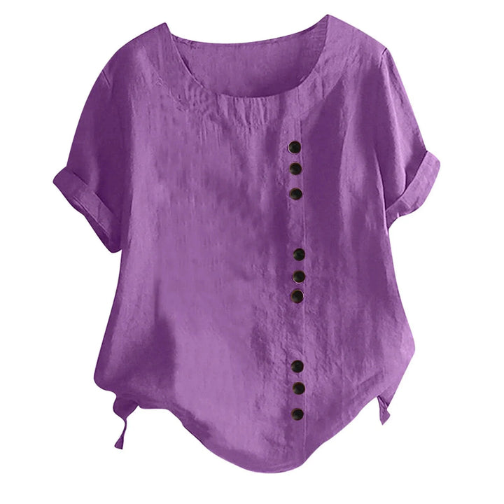 Fashionable women's blouse, a short sleeve button-up with roll tab and asymmetrical design for a modern look.