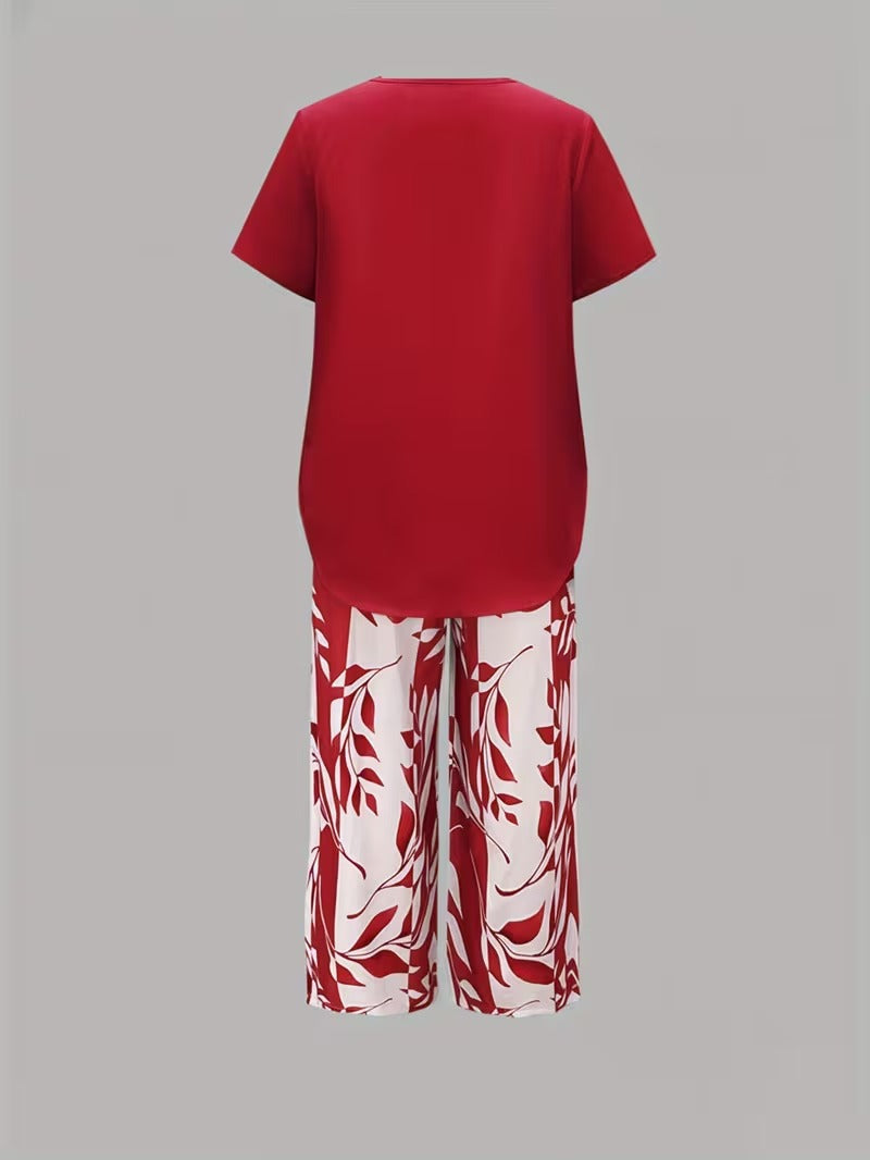Trendy women's leaf print matching outfit, combining summer style with effortless comfort in a pant set.