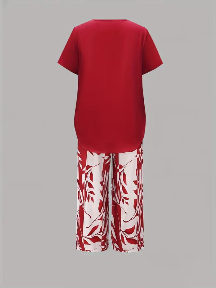Trendy women's leaf print matching outfit, combining summer style with effortless comfort in a pant set.