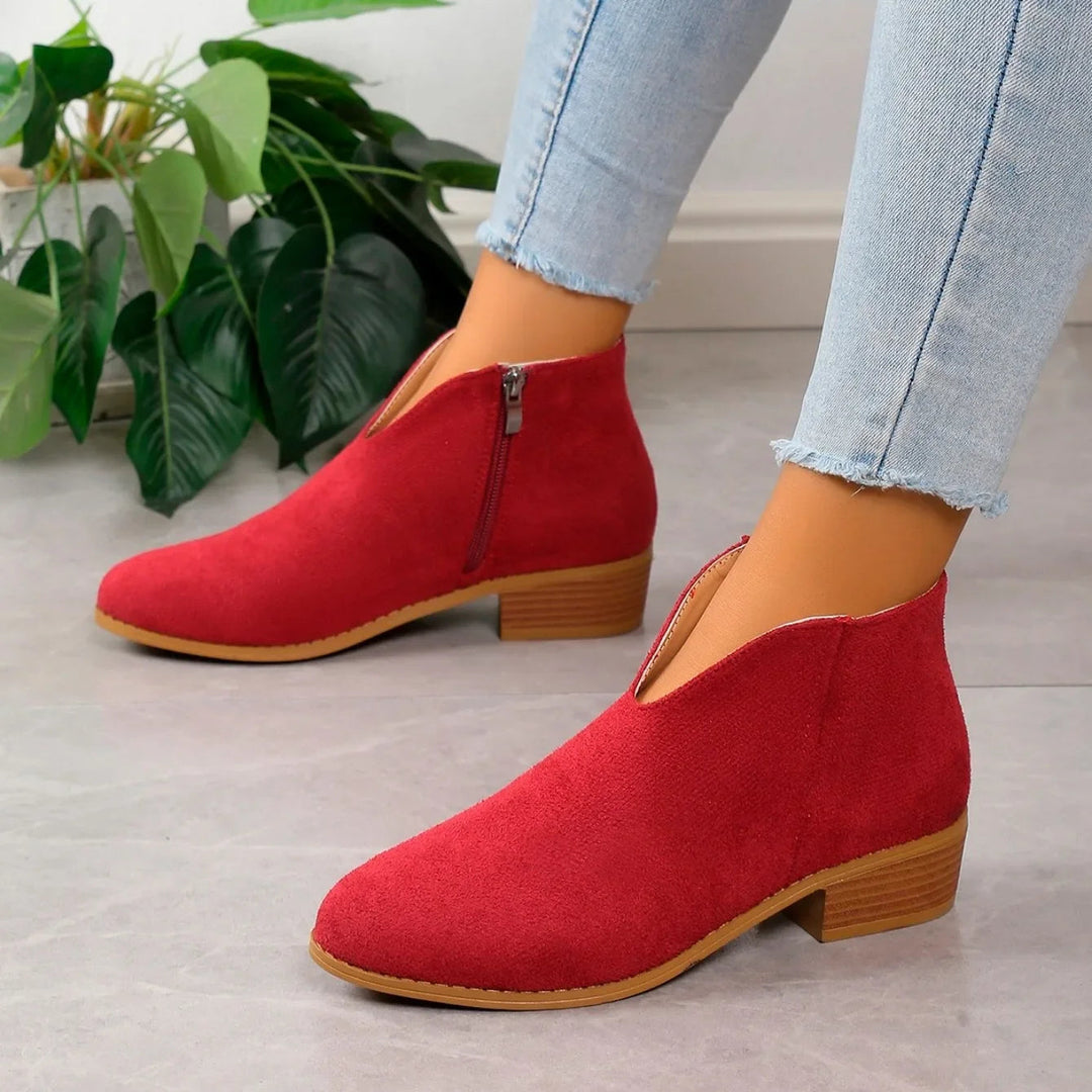 Women's comfortable and stylish leopard print ankle boots, featuring an easy-to-use side zipper.