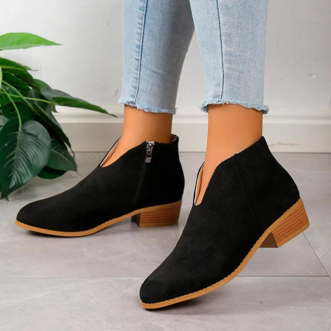 Fashion-forward leopard print ankle boots for women, featuring a durable side zipper.