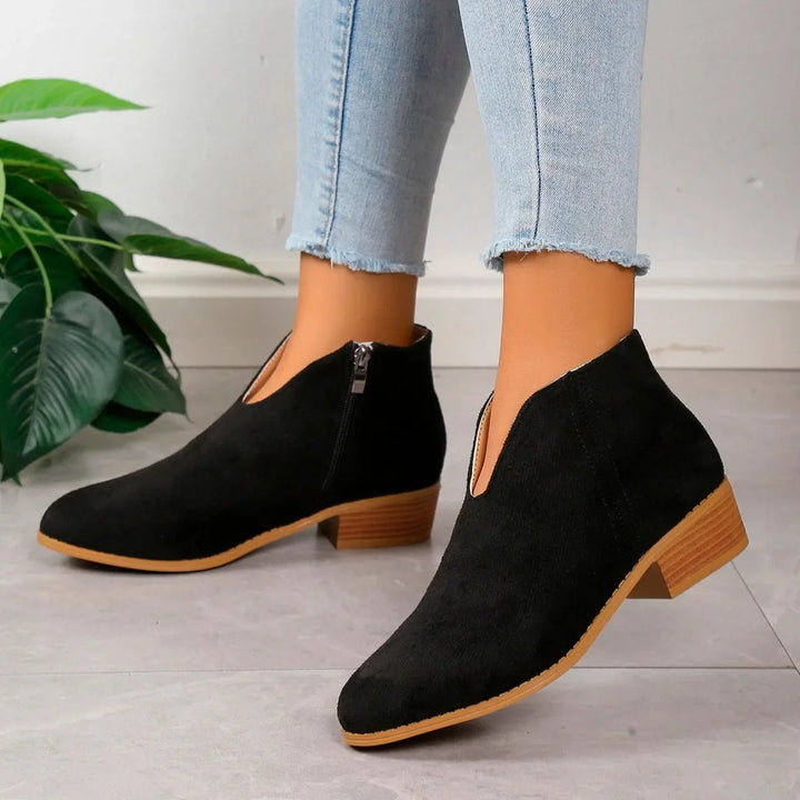 Fashion-forward leopard print ankle boots for women, featuring a durable side zipper.