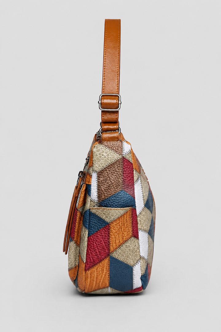 Vibrant patchwork shoulder bag with artistic patterns, a unique women's fashion handbag for a stylish accessory.