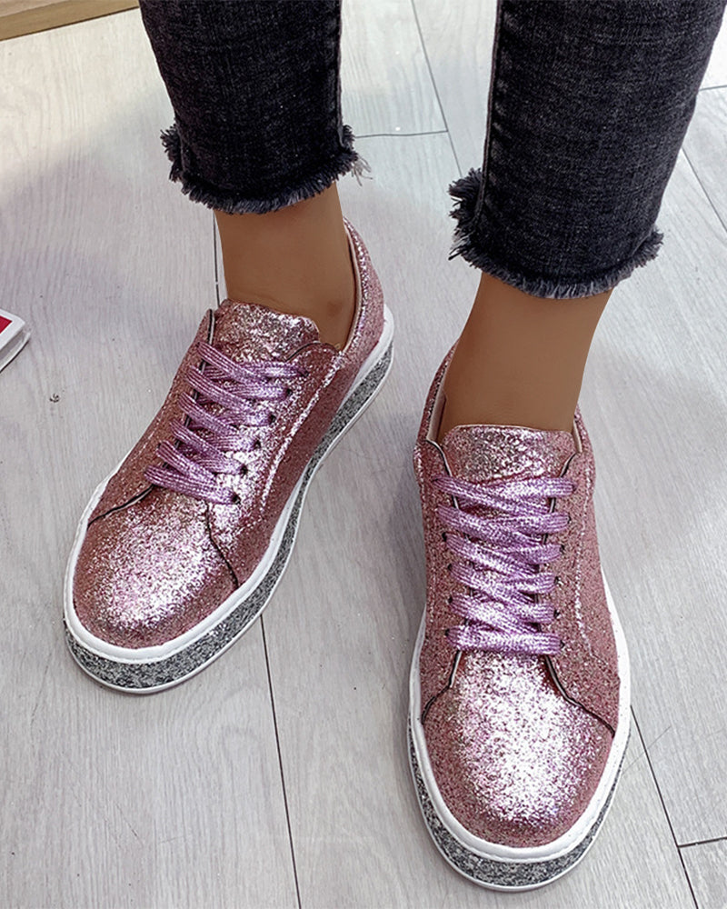 Cushioned women's platform glitter sneakers, offering all-day comfort & a stylish, sparkling look for fashion.